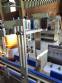 Automatic labeling machine for flat cylindrical bottles and jars Maqmundi
