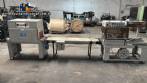 Automatic L-sealer with shrink tunnel.