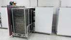Stainless steel dehydrator oven with 120 trays.