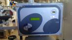 Automatic self-adhesive labeling machine for cylindrical bottles