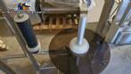 Automatic self-adhesive labeling machine for cylindrical bottles