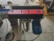Automatic self-adhesive labeling machine for cylindrical bottles