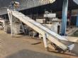 Inclined conveyor belt with talisca