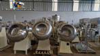 Set of ten stainless steel coating pans with capacities between 150 liters and 350 liters
