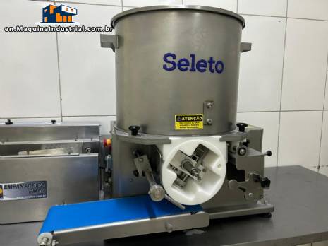 Nugget forming machine for steak cubes and hamburgers. Select production capacity: 2,100 units per hour.