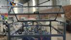 Pick and place product feeder for flowpack transfer cartoning machine