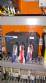 Pick and place product feeder for flowpack transfer cartoning machine