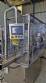 Complete filling line with Tecman Nelpas Tecnoenvase Tudela bottle filling, labeling, capping, and positioning machines for cosmetic liquids.