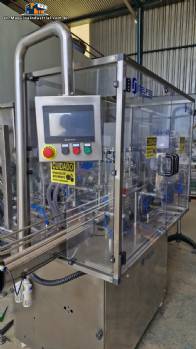 Complete filling line with Tecman Nelpas Tecnoenvase Tudela bottle filling, labeling, capping, and positioning machines for cosmetic liquids.