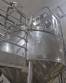 Stainless steel surge tank with agitator, 2000 liters.