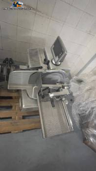 Bizerba automatic stainless steel slicer for cheeses, cold cuts, sausages, and meats.