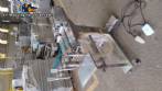 Filling machine with 2 nozzles for liquids and pilfer cap screwer