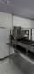 Automatic stainless steel deep fryer for donuts and cream puffs.