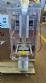 Dosing and packaging machine for granular and powdered products