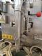 Vertical wrapping machine for triangular format
