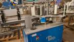 Automatic double-head labeling machine for cylindrical and flat bottles, Tudela, 3,000 labels per hour.