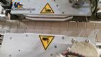 Automatic double-head labeling machine for cylindrical and flat bottles, Tudela, 3,000 labels per hour.