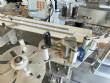 Labeling machine for dropper bottles with double printhead transparent stainless steel label