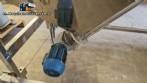 Inclined screw conveyor with stainless steel silo