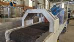 Labeling machine with steam sleeve tunnel and bottle baler