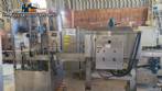 Labeling machine with steam sleeve tunnel and bottle baler
