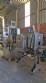 Labeling machine with steam sleeve tunnel and bottle baler