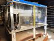 Zegla rotary filling machine with rinser and three-block capping system.