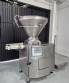 Handtmann vacuum stuffer with twister and tilting elevator, up to 6,000 kg per hour.