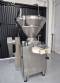 Handtmann vacuum stuffer with twister and tilting elevator, up to 6,000 kg per hour.